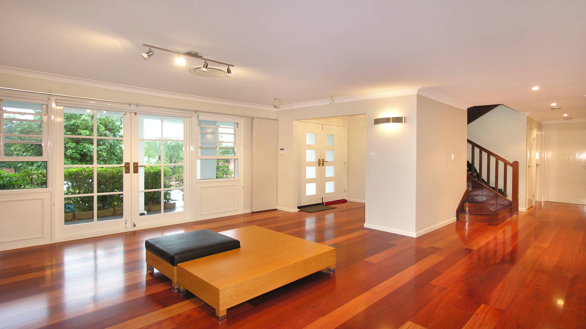 The front of the house forms a large open plan living area with solid timber stairs.